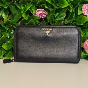 Prada black leather zip around long wallet